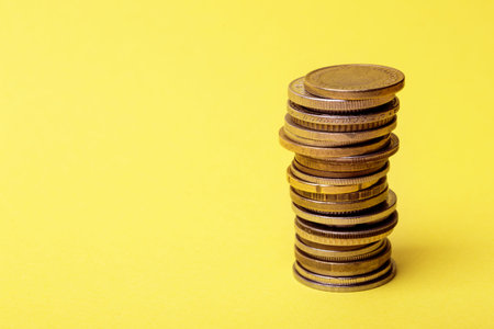 coins are lined with a column on a yellow background