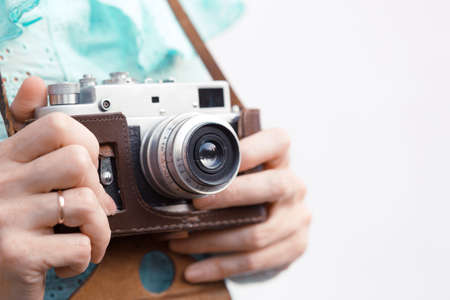 Girl with retro camera. Vintage.の写真素材