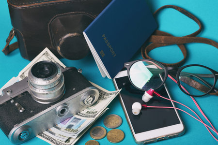 background for a trip - map, glasses, camera, smartphone, passport, dollars, headphones