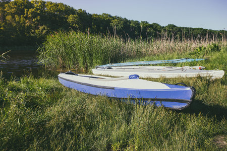 summer and active sport. kayaks lie on the grass