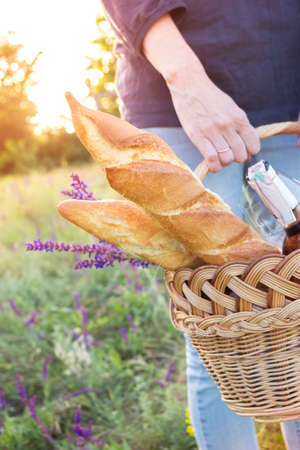 Summer - Girl with a basket goes on a picnicの写真素材