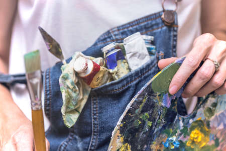 time of creativity. girl painter holds a brushの写真素材