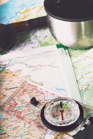 retro style abstract shoot with the compass on a map