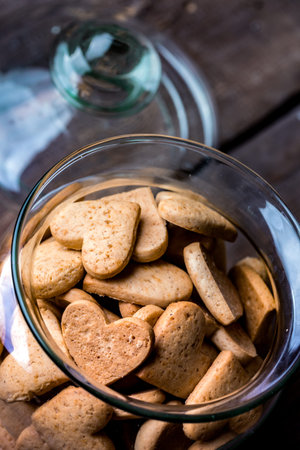 gingerbread in heart shape in a glass jar