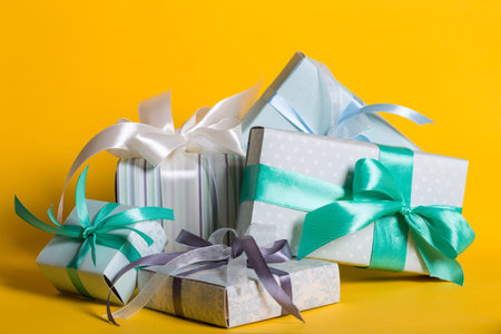 preparation for the holiday - a group of gifts on a yellow background