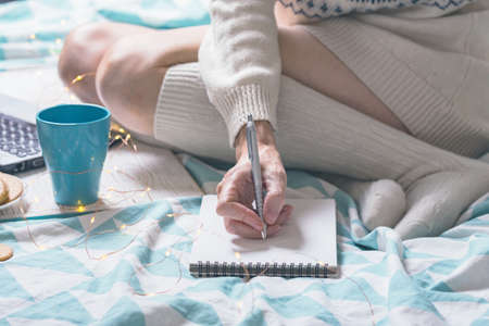 background - beautiful cozy morning and and the girl is planning her dayの写真素材