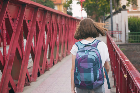 Teen girl walking on a bridge. Wroclaw, Polandの写真素材