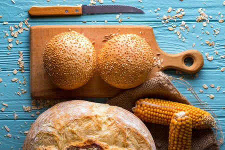 different fresh bread and buns  on a blue backgroundの写真素材