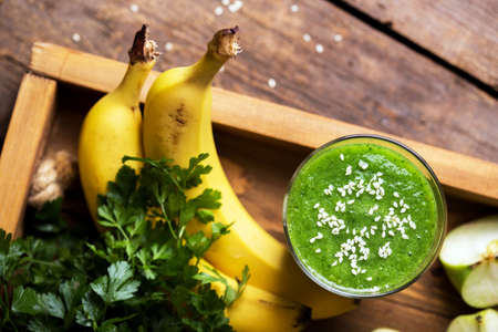 healthy breakfast - parsley, apple and banana smoothies. raw foods and vegetarianismの写真素材