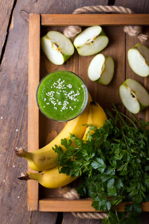 healthy breakfast - parsley, apple and banana smoothies. raw foods and vegetarianismの写真素材