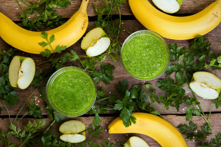 healthy breakfast - parsley, apple and banana smoothies. raw foods and vegetarianismの写真素材