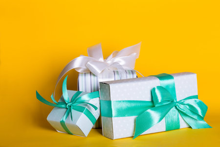 preparation for the holiday - a group of gifts on a yellow background. Birthday