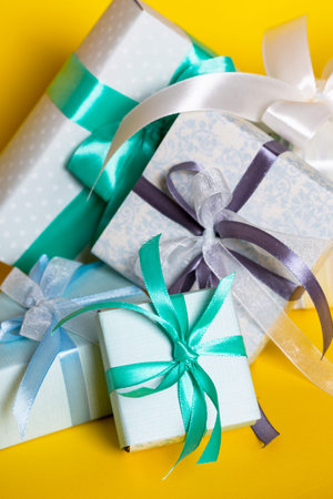 preparation for the holiday - a group of gifts on a yellow background. Birthday