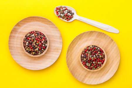 herbs and spices. peppers mix on yellow background