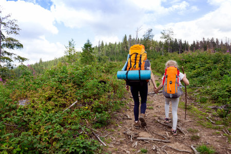 family - mother and daughter  hikers at the Carpathians mountains. gorgany, Ukraine.