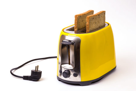 breakfast. yellow toaster on a white background
