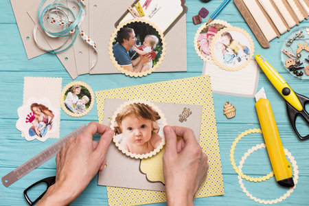 scrapbook background. the process of creating a childrens album. Card and tools with decoration