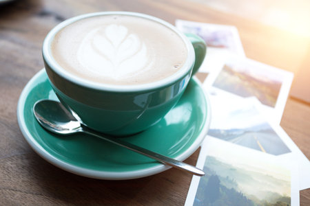 table by the window in a cafe and a cup of coffee