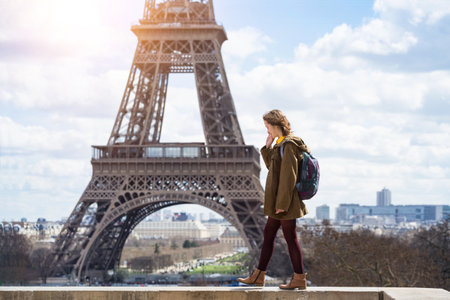 happy girl on the background of the Eiffel Tower in Paris. France. tourism around the worldのeditorial素材