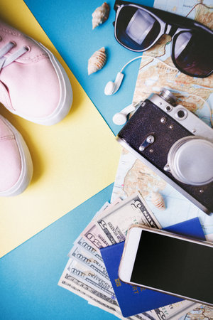 background for a travel - watches, sneakers, map, dollars, glasses, camera, headphones. what to take on a tripのeditorial素材
