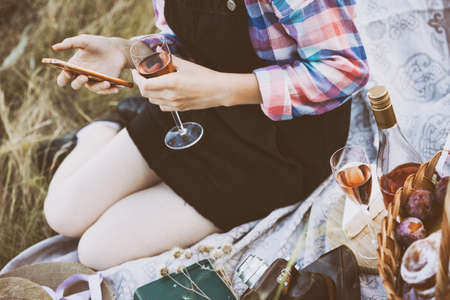 Summer - picnic in the meadow.  girl with a glass in handの写真素材