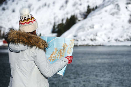 tourist girl with a map at the lofoten islands. Norwayの写真素材