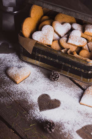 christmas background. homemade cakes for new Year - ginger cookies in the form of hearts in the old boxの写真素材