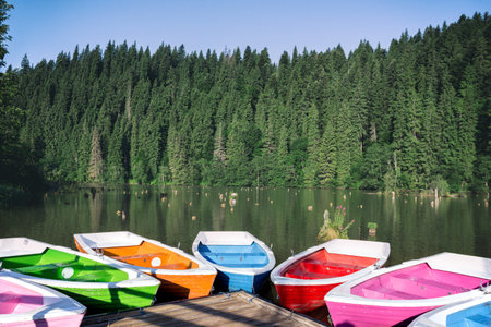 bright multicolored boats on a mountain lake