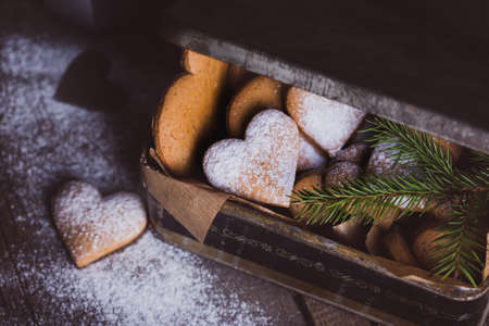 christmas background. homemade cakes for new Year - ginger cookies in the form of hearts in the old boxの写真素材