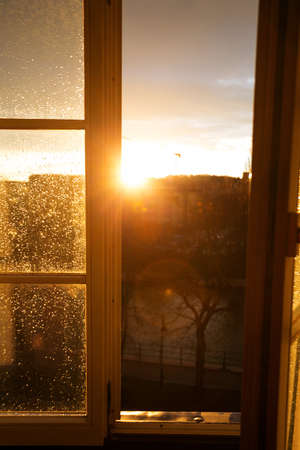 raindrops on a window pane at sunsetの写真素材