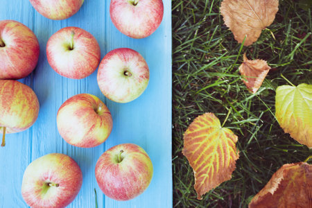 juicy apples on a wooden blue background