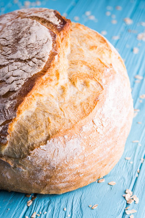 big loaf of bread on a wooden table