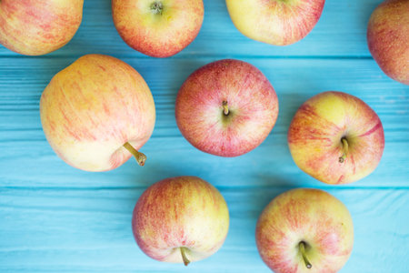 juicy apples on a wooden blue background