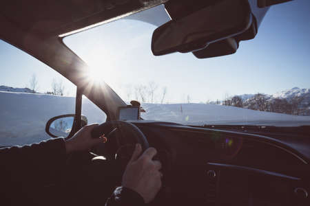 roadtrip - man hands on the wheel and norwegian mountains.  Lofoten Islands. Norway.の写真素材