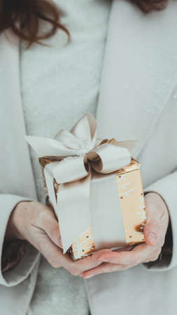 girl holding christmas presents in hands -  happy New Years
の写真素材