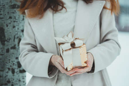 girl holding christmas presents in hands -  happy New Yearsの写真素材