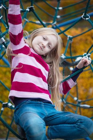 smiling little girl at the playground