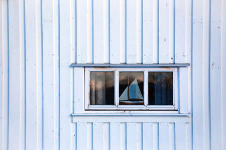 white norwegian house. window and ship. Lofoten Islands. Norway. world travel
の写真素材