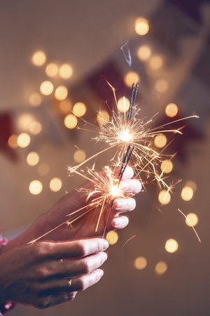 girl holds bengal lights - happy christmas and merry holidays