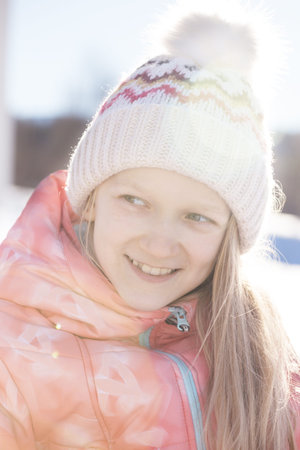 little Norwegian girl smiling. Fun winter. Norway