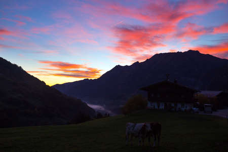 beautiful landscape - bright sunrise in the mountains of austriaの写真素材