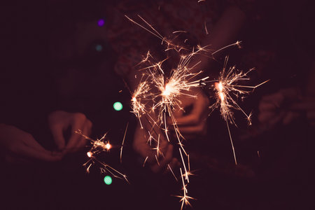 girl holds bengal lights - happy christmas and merry holidays