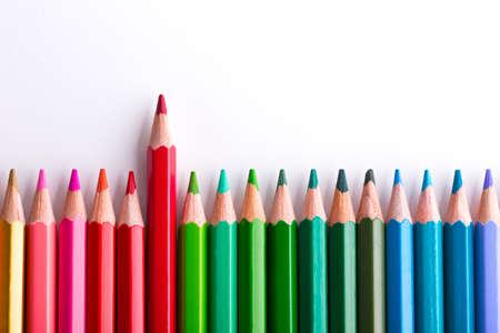 leadership concept with one pencil standing out of crowd of other pencilsの写真素材