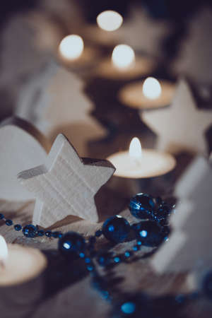 Christmas background of candles and wooden toysの写真素材