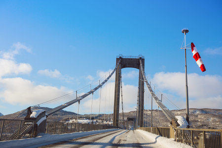 suspension bridge against a beautiful Norwegian landscape at the Lofoten Islands, Norway 