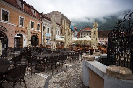 BRASOV, ROMANIA JULY 24, 2019: view of the cafe at the main square at the Brasov. BRASOV, ROMANIA,...