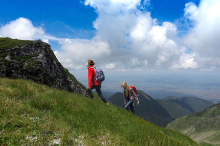 girls hiker on a path at the mountains. Transfogaras. Romaniaの写真素材