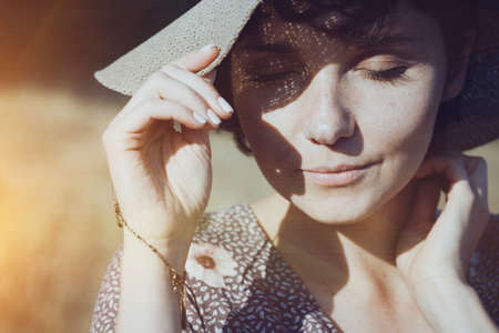 portrait of a happy beautiful girl with closed eyes. emotions and moodの写真素材