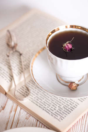 cup of tea and a book. vintage style. still lifeの写真素材