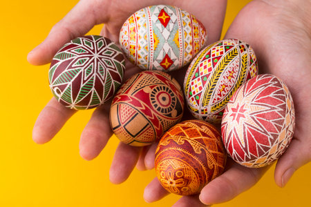 happy easter card. girl holds in hands beautiful Easter egg Pysanka handmade - ukrainian traditional...